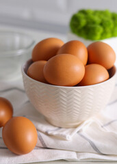 fresh farm chicken eggs on a colored background. Vertical photo format