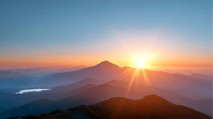 Breathtaking spectacle of a radiant sunrise over an expansive mountain landscape where layered peaks meet a tranquil body of water bathed in warm glow and brilliant rays of dawn