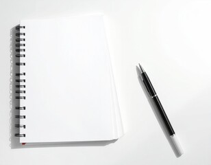 Open blank spiral notebook with pen on white background