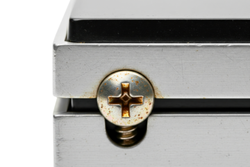 Macro view of rusty screw head on brushed silver metal plate on a transparent background