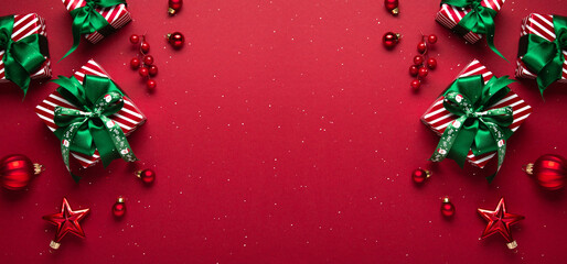 Merry Christmas and Happy Holidays greeting card, frame, border. New Year. Red Christmas ornaments...