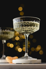 Elegant champagne glass with festive bokeh background