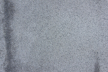 Asphalt background. Dark grey bitumen texture.