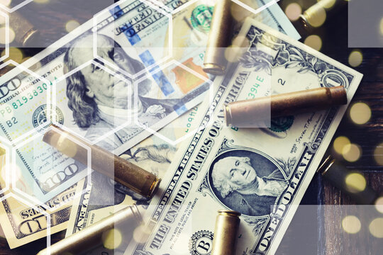 Live ammunition with bullets,  bills, close-up, selective focusing. Concept: sale of weapons under lend-lease, assistance with weapons, mercenaries in the army, trade in ammunition.
