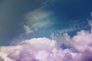 Beautiful sunset sky above clouds with dramatic light. Cabin view from airplane