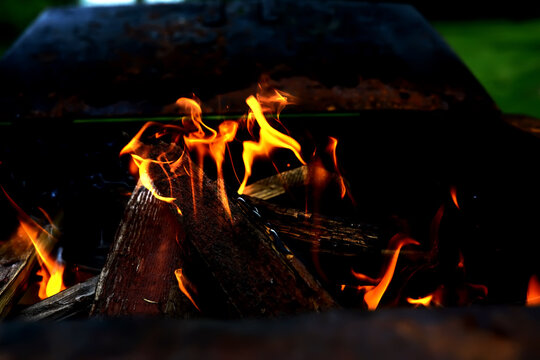 Background of the flame in the oven. Tongues of fire in a fireplace. Fire texture. - Powered by Adobe