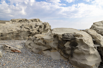 Eroded rock formations on the beach in Bordighera on the italian riviera