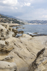 Eroded rock formations on the beach in Bordighera on the italian riviera