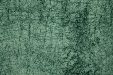 Dark green marbled paper texture background
