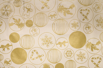 Golden Christmas pattern on beige wrapping paper
