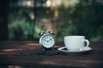 Naklejka premium Close up hands of man sitting office desk holding sweet coffee cup relax and enjoy with happy time. Hot coffee mug in hand. Man holding coffee cup relaxing after work at office warm taste in cafe