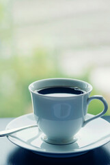 Vertical Close up hands of woman sitting office desk holding sweet coffee cup relax and enjoy with happy time. Vertical Horizon Hot coffee mug in hand. Woman hand holding coffee cup relax at office