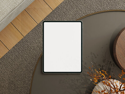 Tablet mockup on a modern coffee table with an autumn-themed decoration in a cozy setting.