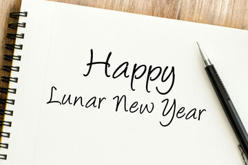 Warm wishes for a prosperous Lunar New Year handwritten on a notepad, celebrating festive traditions and new beginnings for the year ahead