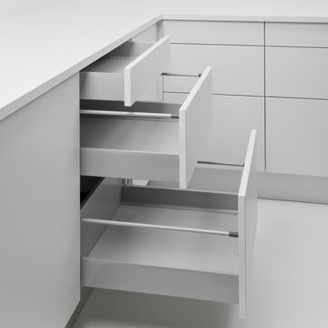 Modern cabinet with three open drawers of varying sizes, designed for efficient, minimalist kitchen storage.