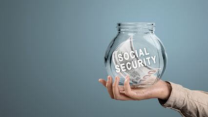 Human hand holding a jar with United States dollar bills and Social Security text. Concept of...