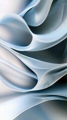 Close-up of flowing, abstract fabric in shades of blue. The fabric has a soft, ethereal quality, with gentle curves and folds.