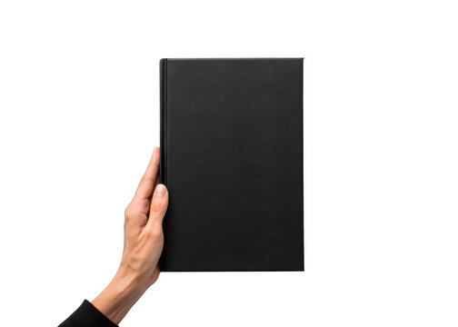hand holding blank black hardcover book isolated on a transparent background.
