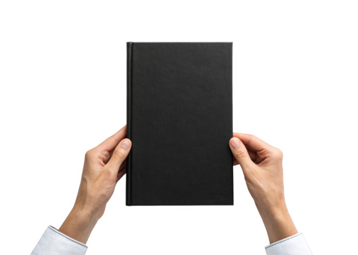 hand holding blank black hardcover book isolated on a transparent background.