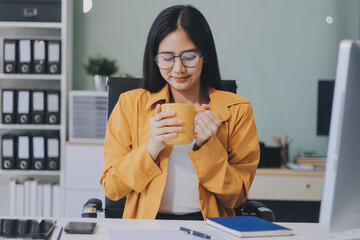 Business woman using calculator for do math finance on wooden desk in office and business working background, tax, accounting, statistics and analytic research concept.