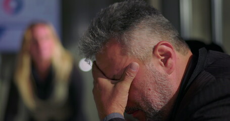 Obraz premium Female boss snapping man out of deep thought with loud reprimand during tense office meeting, assertive leadership and sudden confrontation in corporate environment