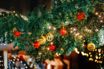 Festive Christmas garland with glowing ornaments.