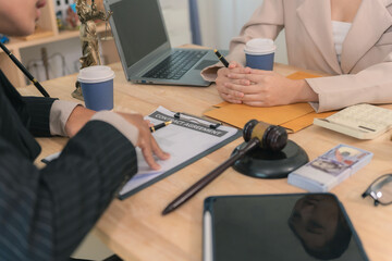 Businessman and male lawyer consulting, having team meeting with client. Justice lawyer having team...
