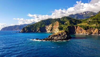 Fototapeta premium Dramatic coastal cliffs meet the azure sea under a bright sky.