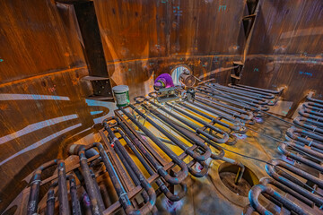 Welding male worker metal is part foam coil of machinery plate  bottom tank beam construction smoke