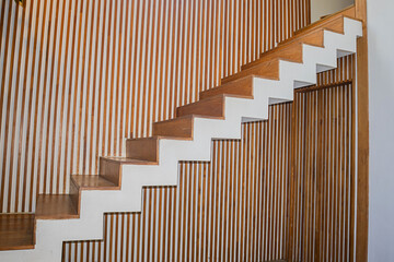 Modern style wooden stairs inside the house or office