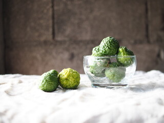 kaffir lime friut on nature fabric background 