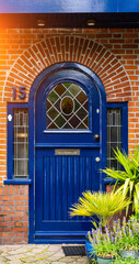 typical century Dutch door holland view in a fortified town with brick houses and front flower gardens. Typical dutch door