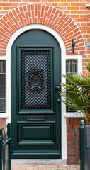 Fototapeta premium Typical dutch door. Dutch holland architectural detail, a door in Netherlands city. Dutch door