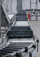 packing line in a logistics warehouse. conveyor belt in a modern production line