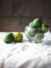 kaffir lime friut on nature fabric background 