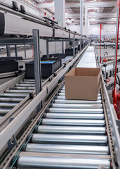 packing line in a logistics warehouse. conveyor belt in a modern production line
