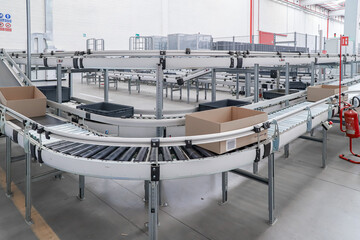 packing line in a logistics warehouse. conveyor belt in a modern production line