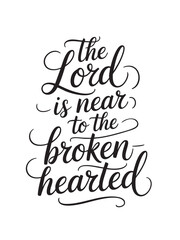 A decorative hand-lettered design featuring the inspirational religious phrase The Lord is near to the brokenhearted