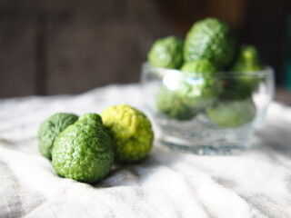 kaffir lime friut on nature fabric background 