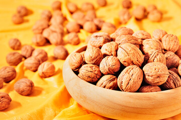 Bowl with whole walnuts ready to eat