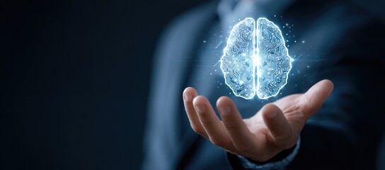 Hand holding glowing digital brain circuit hologram against dark background.