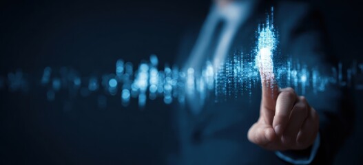 Finger touching glowing blue digital data stream in darkness