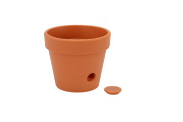 Orange plastic flowerpot with drainage hole and plug