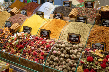 A vibrant display of spices and teas, offering a sensory feast of colors and aromas. The image captures a wide array of products.