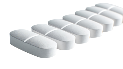 Pharmaceutical white oblong tablets with central score line arranged in clean organized medical layout shown clearly in studio on white background