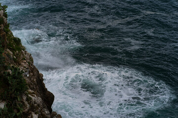 Waves breaking on rocks
