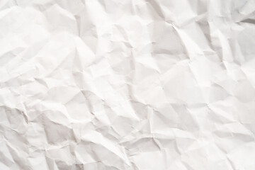 Grunge wrinkled white color paper textured background with copy space. Use for decoration or layer