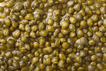 Close-up of pickled capers on background. Healthy food ingredient