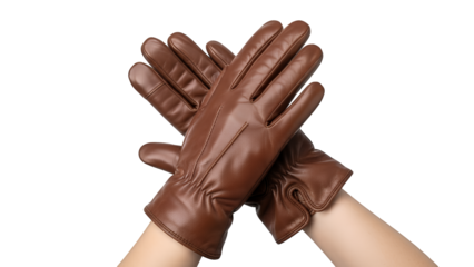 Stylish pair of brown leather gloves worn on crossed hands, showcasing a fashionable and warm accessory, studio shot isolated on transparent background