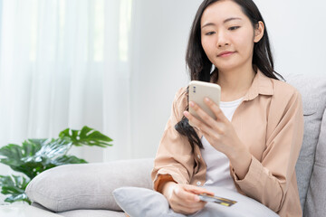 woman using smartphone for online shopping at home. stay home, technology, electronic commerce,...